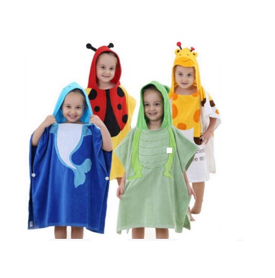 Children wearing colorful hooded towel ponchos