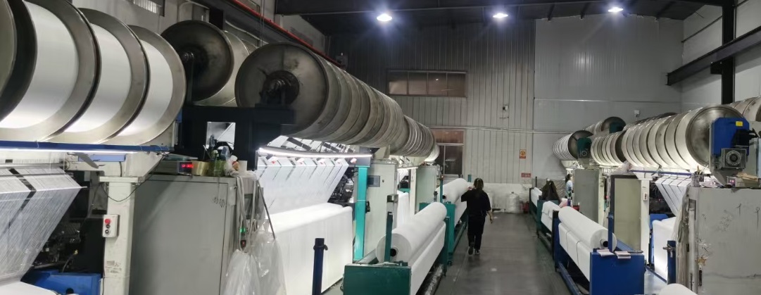 Textile weaving machines preparing towel fabric