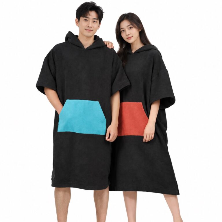 Chinese adult models wearing black short-sleeved hooded towel ponchos with colored pockets on a white background