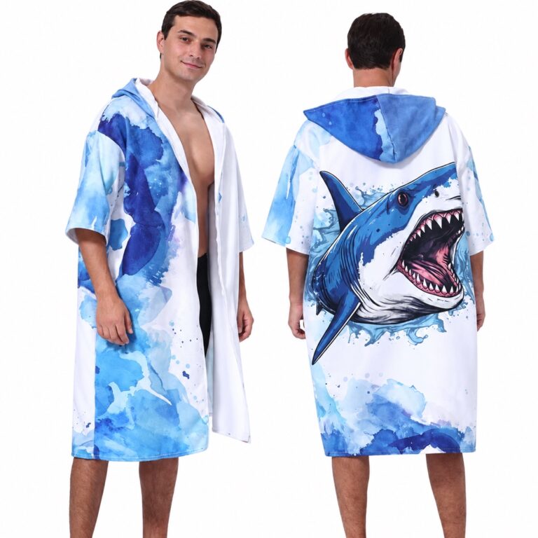 Front and back views of a blue and white shark-print zip-front hooded towel poncho on a white background