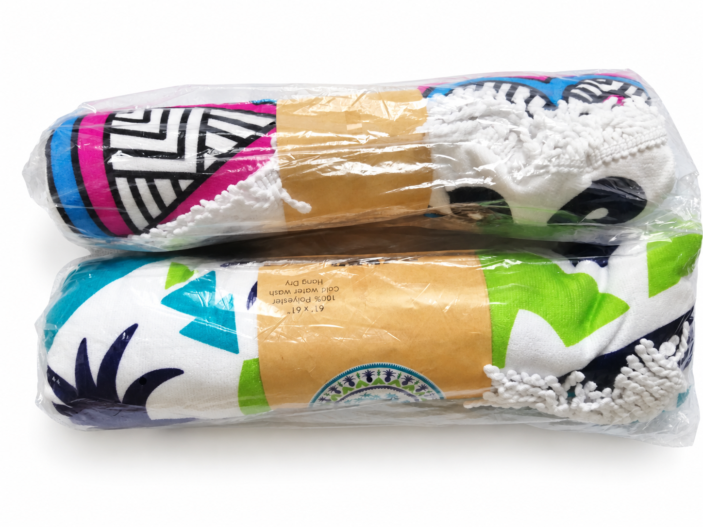 Printed round beach towels in clear retail bags with paper bands on a white background