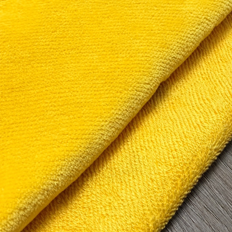 Yellow cotton velour fabric showing pile and reverse