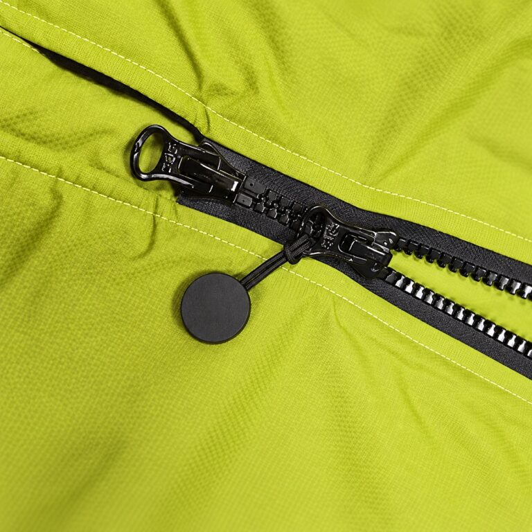 Close-up of a two-way zip on green changing robe fabric