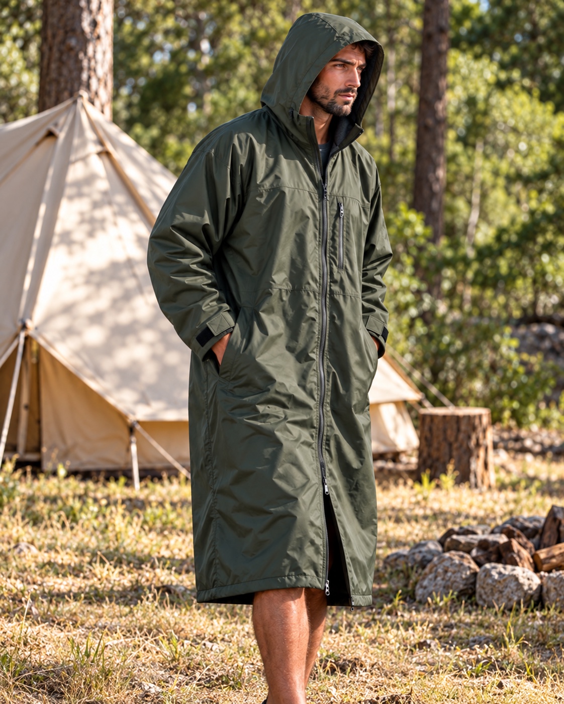 Illustrative waterproof shell options in a woodland campsite with one beige canvas tent and green trees, dry grassy ground