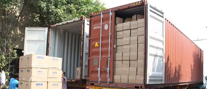Cartons being loaded into a shipping container