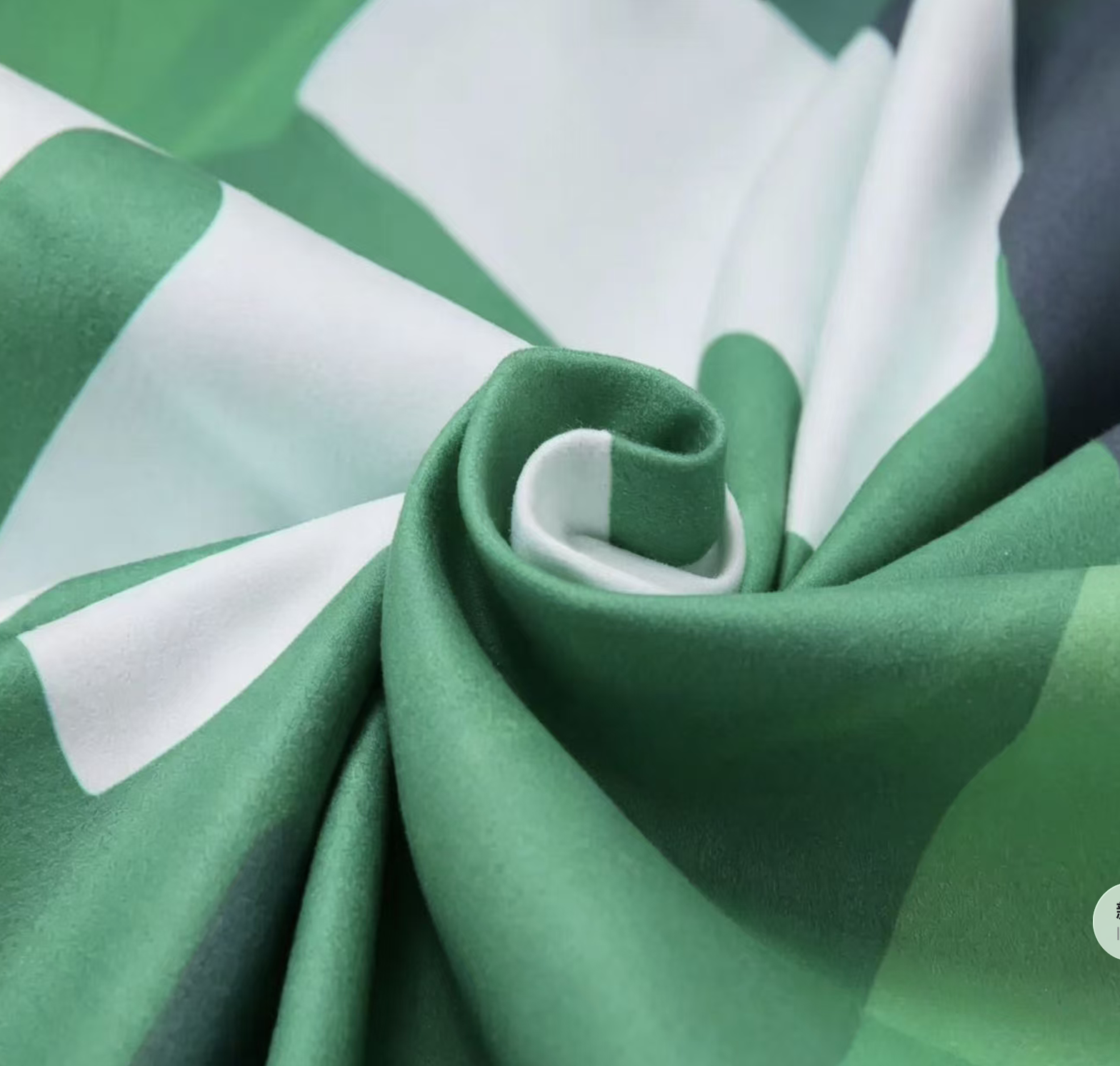 Close-up of green and white microfiber suede towel fabric