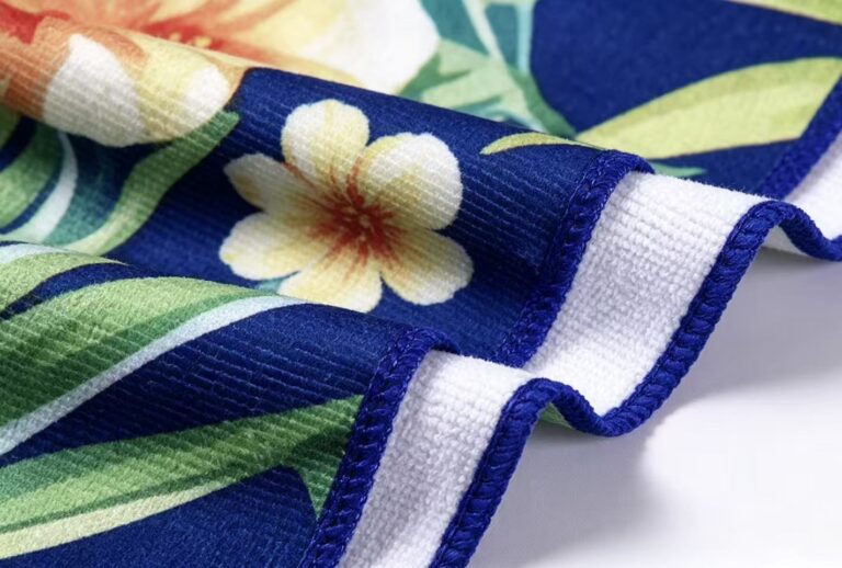 Blue floral printed microfiber terry towel showing loop texture