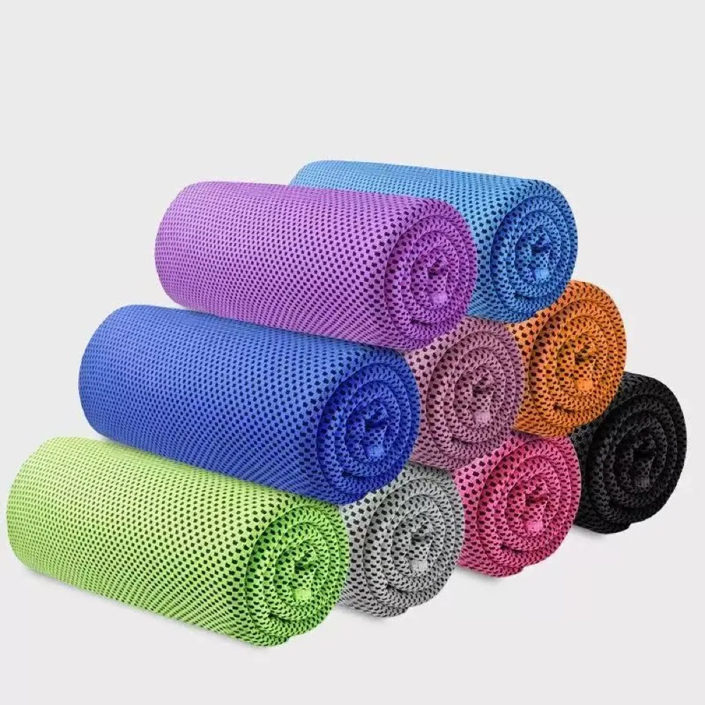 Multicolored mesh cooling towels rolled on a plain background