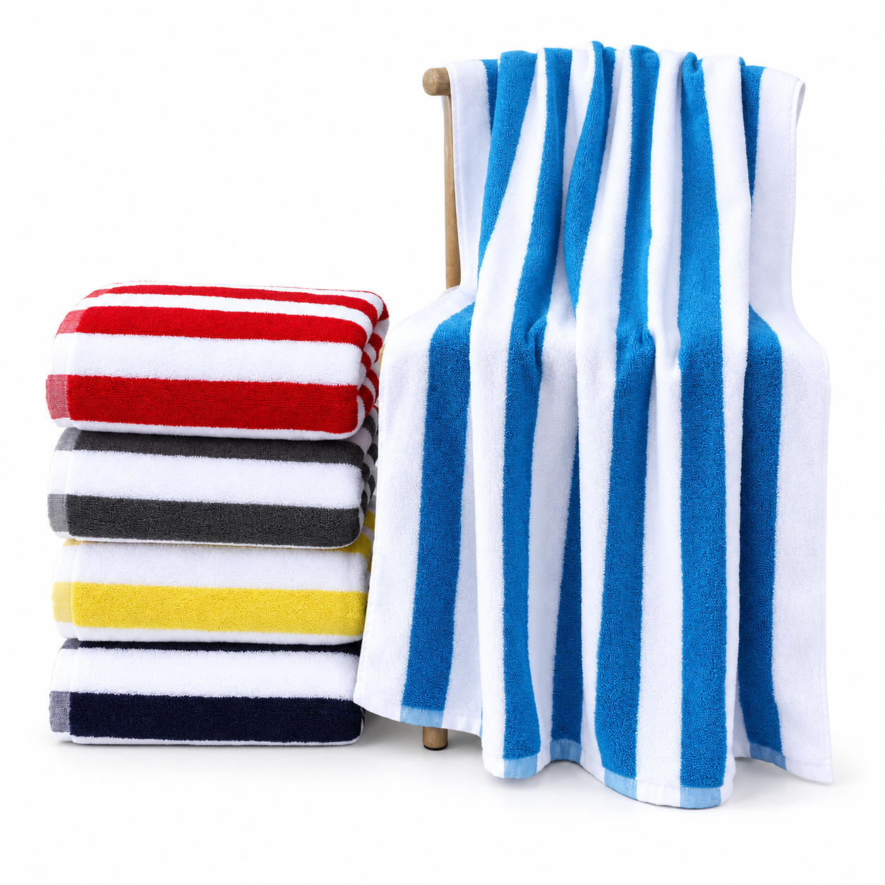 Blue and white striped cotton terry beach towel beside folded red, grey, yellow and navy striped towels