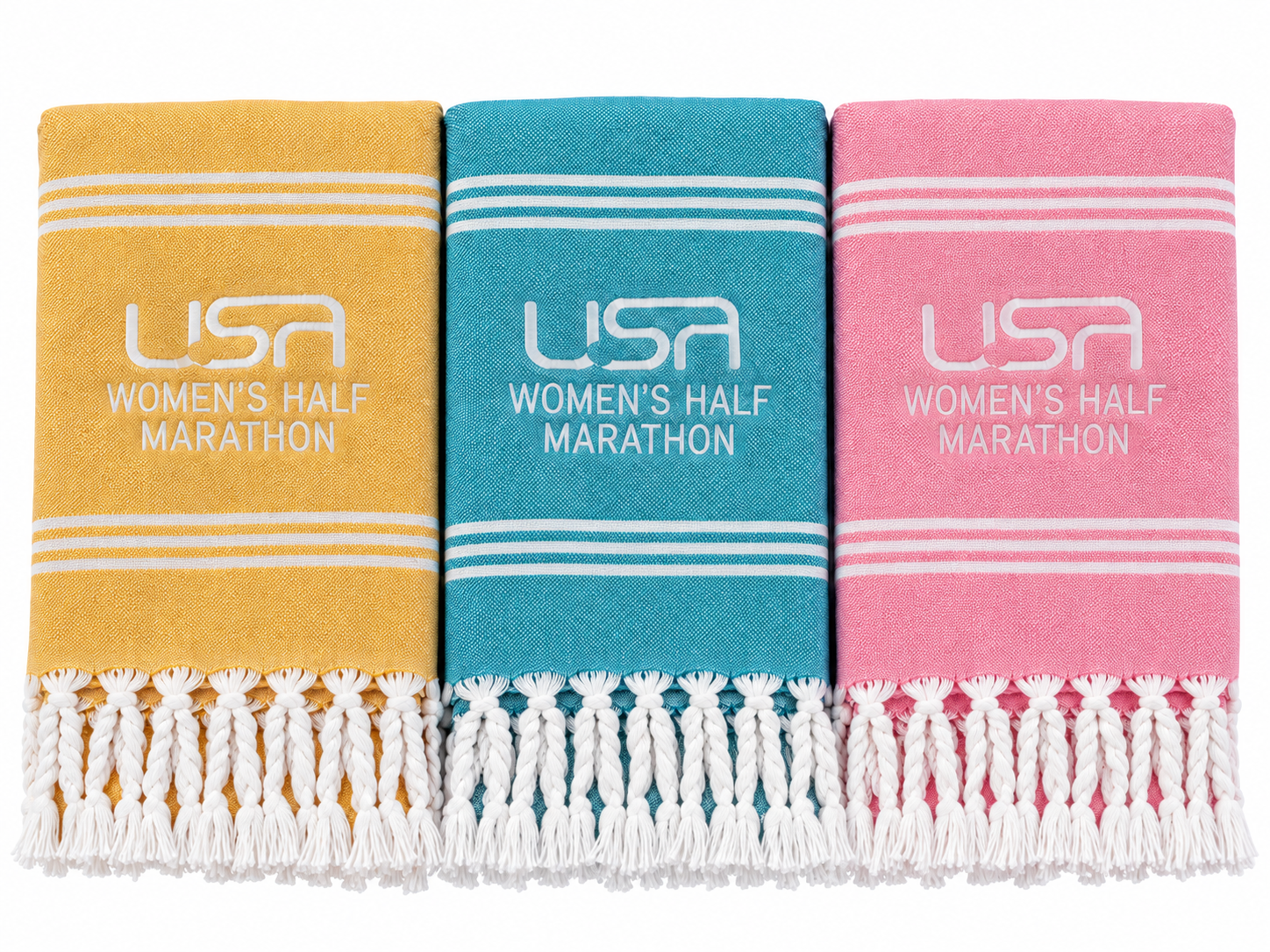 Yellow, blue and pink fringed Turkish towels with custom embroidered event logos